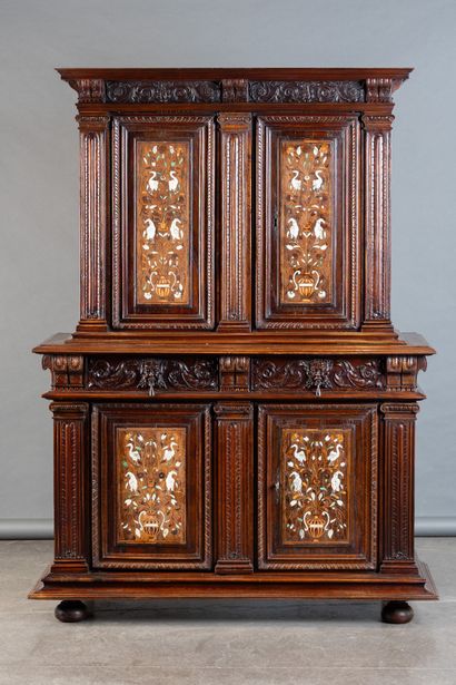 Two-part cabinet in molded and carved walnut,...