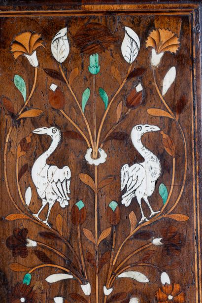 Two-part cabinet in molded and carved walnut,...
