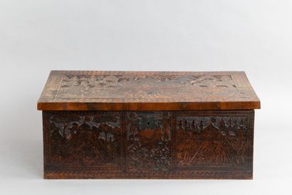 Cedar chest with a top-opening lid, featuring...