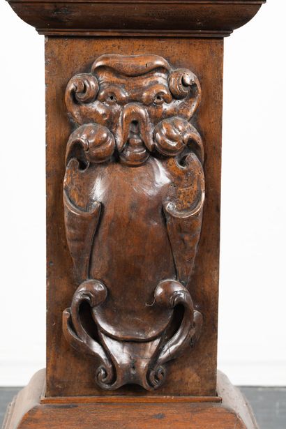 Pair of walnut half-columns with carved capitals...