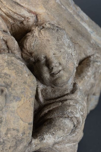 Carved limestone console with traces of polychromy,...