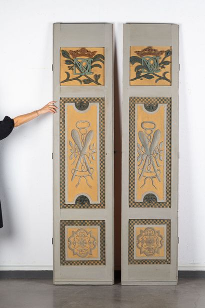 Two three-panel doors, partially re-lacquered...