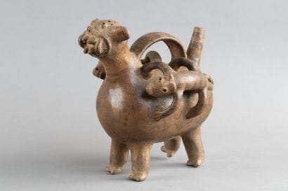 A whistling vase depicting a feline, whose...