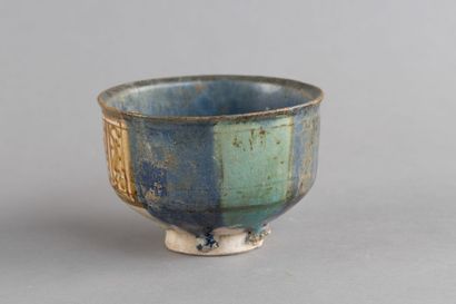 Tall ceramic cup with metallic lustre decoration...