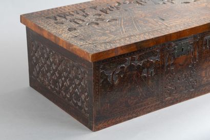 Cedar chest with a top-opening lid, featuring...