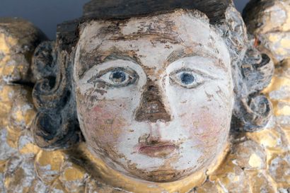 Head of a winged cherub, carved from oak,...