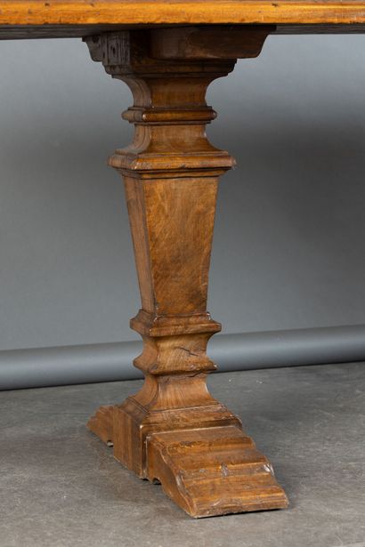 Walnut table with burl inlay; the tabletop...