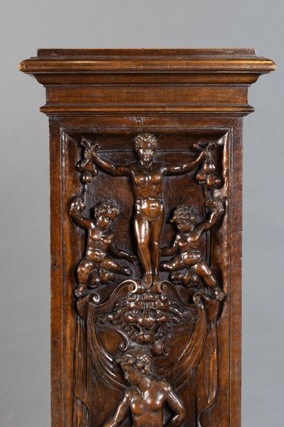 Case in molded and carved walnut, front panel...
