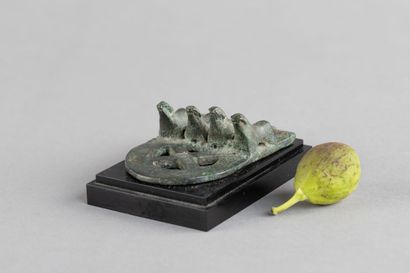 Belt buckle decorated with four mammals....
