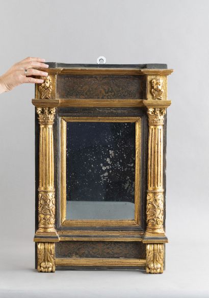 Molded and carved wooden mirror; the mirror...