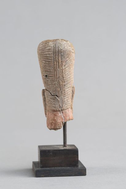 Bust of a female statuette. Terracotta with...
