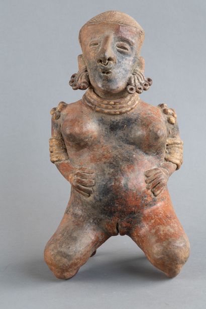 Statuette of a woman in labor. She is depicted...