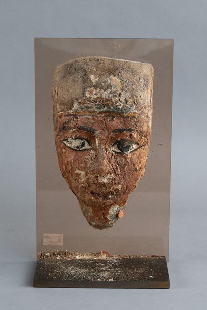 Anthropomorphic mask from a sarcophagus lid....