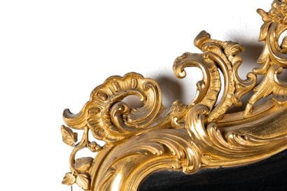 Large beveled mirror with a wooden frame...