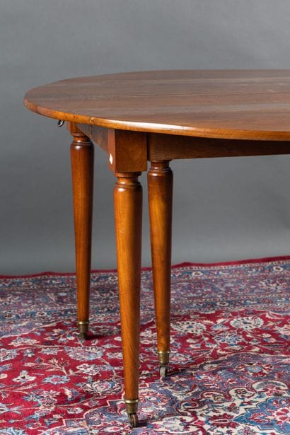 Walnut dining table with two folding panels....