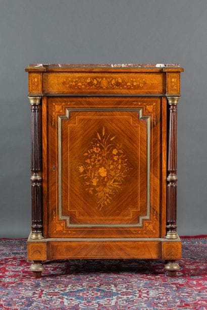 A counter-height cabinet made of veneered...