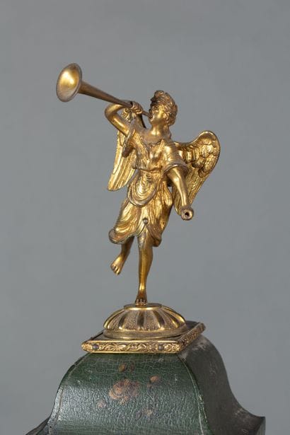 A clock with a lacquered wooden base decorated...