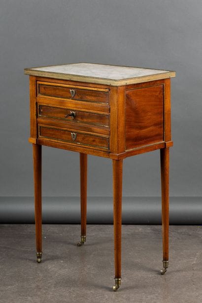 Mahogany coffee table with brass quarter-round...