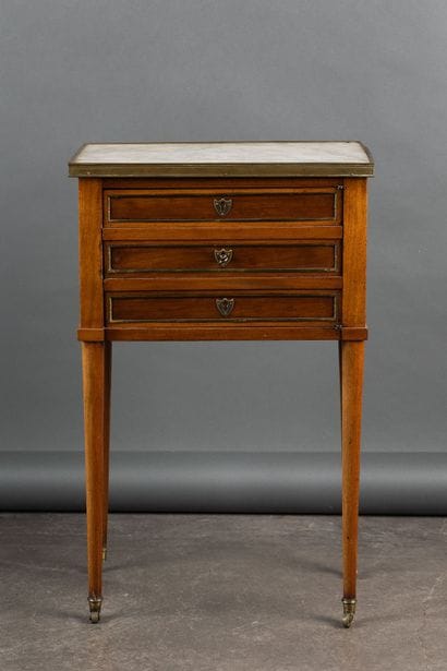 Mahogany coffee table with brass quarter-round...