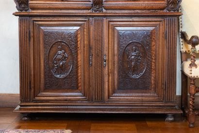 A small two-section sideboard in molded and...