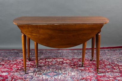 Walnut dining table with two folding panels....