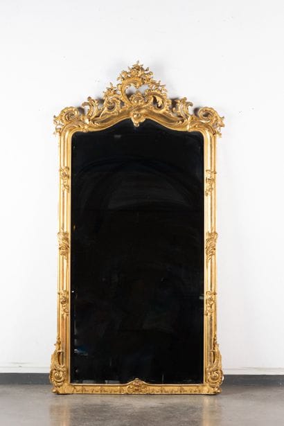 Large beveled mirror with a wooden frame...