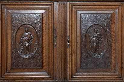 A small two-section sideboard in molded and...