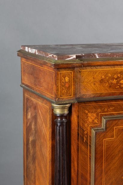 A counter-height cabinet made of veneered...