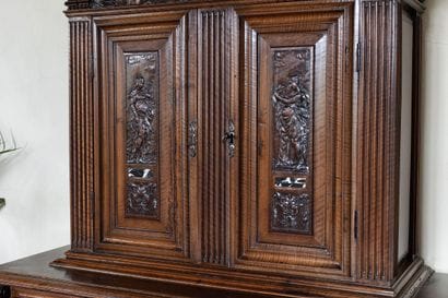 A small two-section sideboard in molded and...
