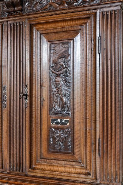 A small two-section sideboard in molded and...