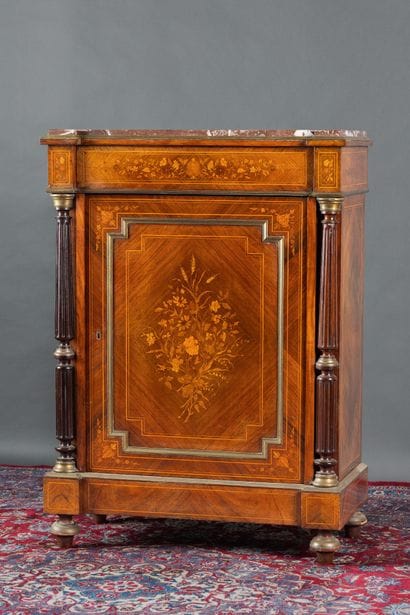 A counter-height cabinet made of veneered...