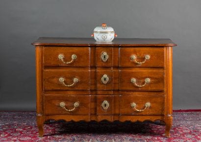 Molded walnut chest of drawers with three...
