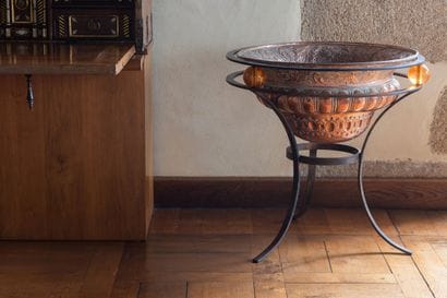 Copper repoussé cooling basin with gadroons...