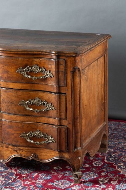 Molded cherry wood chest of drawers. Features...