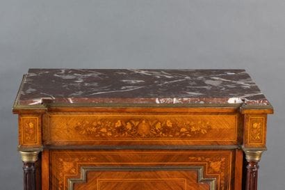 A counter-height cabinet made of veneered...