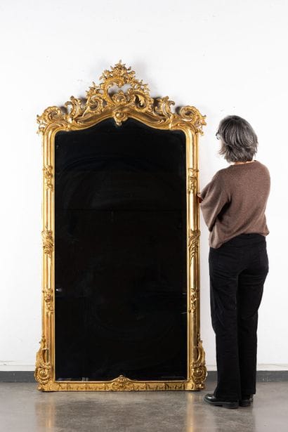 Large beveled mirror with a wooden frame...