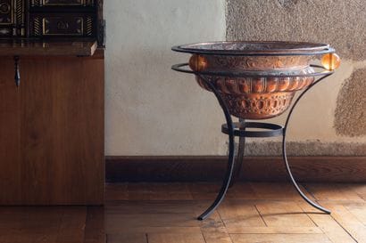 Copper repoussé cooling basin with gadroons...
