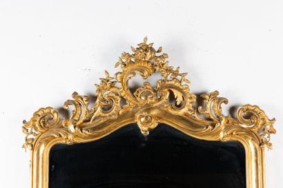 Large beveled mirror with a wooden frame...
