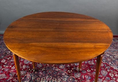 Walnut dining table with two folding panels....