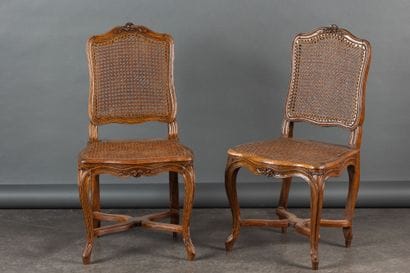 Pair of chairs in molded and carved walnut,...