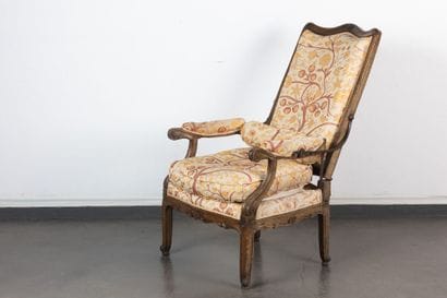 Molded and carved walnut armchair with rack-mounted...
