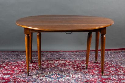 Walnut dining table with two folding panels....