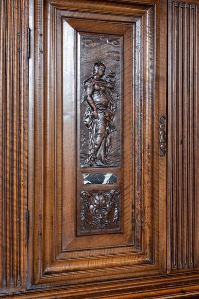 A small two-section sideboard in molded and...