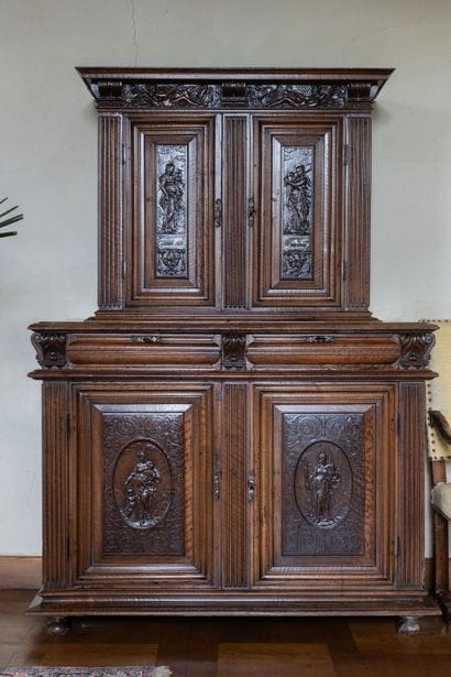 A small two-section sideboard in molded and...