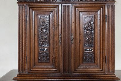 A small two-section sideboard in molded and...