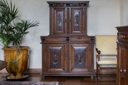 A small two-section sideboard in molded and...