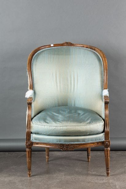 Gondola-style armchair in molded and carved...