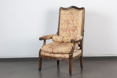 Molded and carved walnut armchair with rack-mounted...