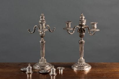 Pair of silver plated candlesticks with three...