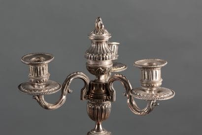 Pair of silver plated candlesticks with three...